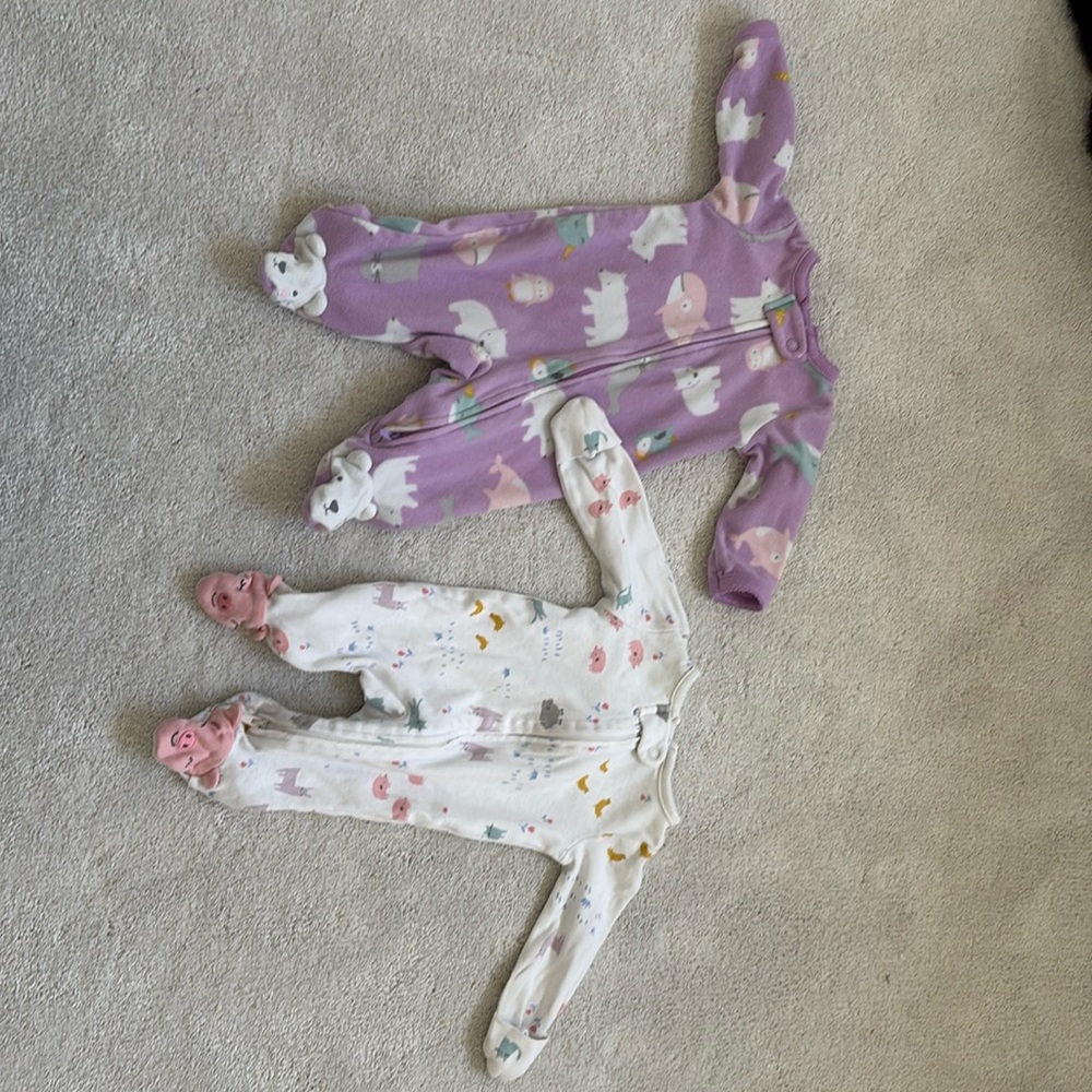 Two newborn sleepers.  Size newborn.  Animal patterns. Minimally worn.